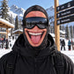 Prank Old Man Mask 2 option: printed big grin face cover with tongue out, worn with ski goggles