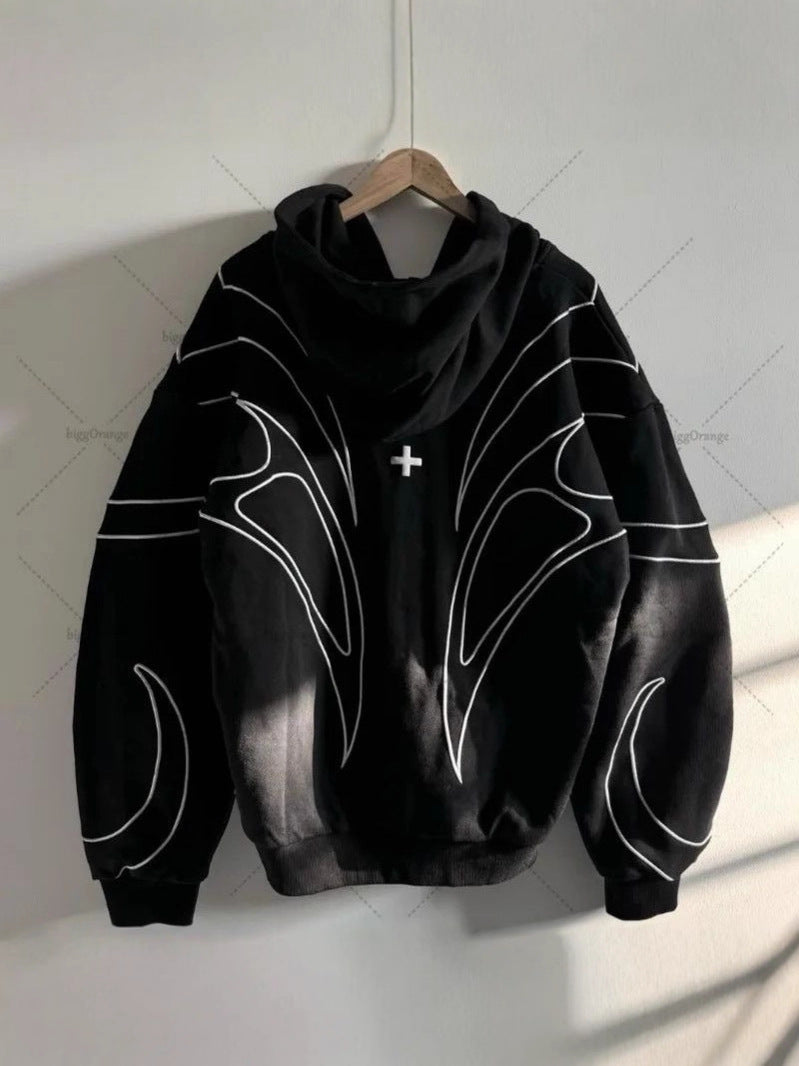 Back detail of white winged line embroidery on a black zip up hoodie