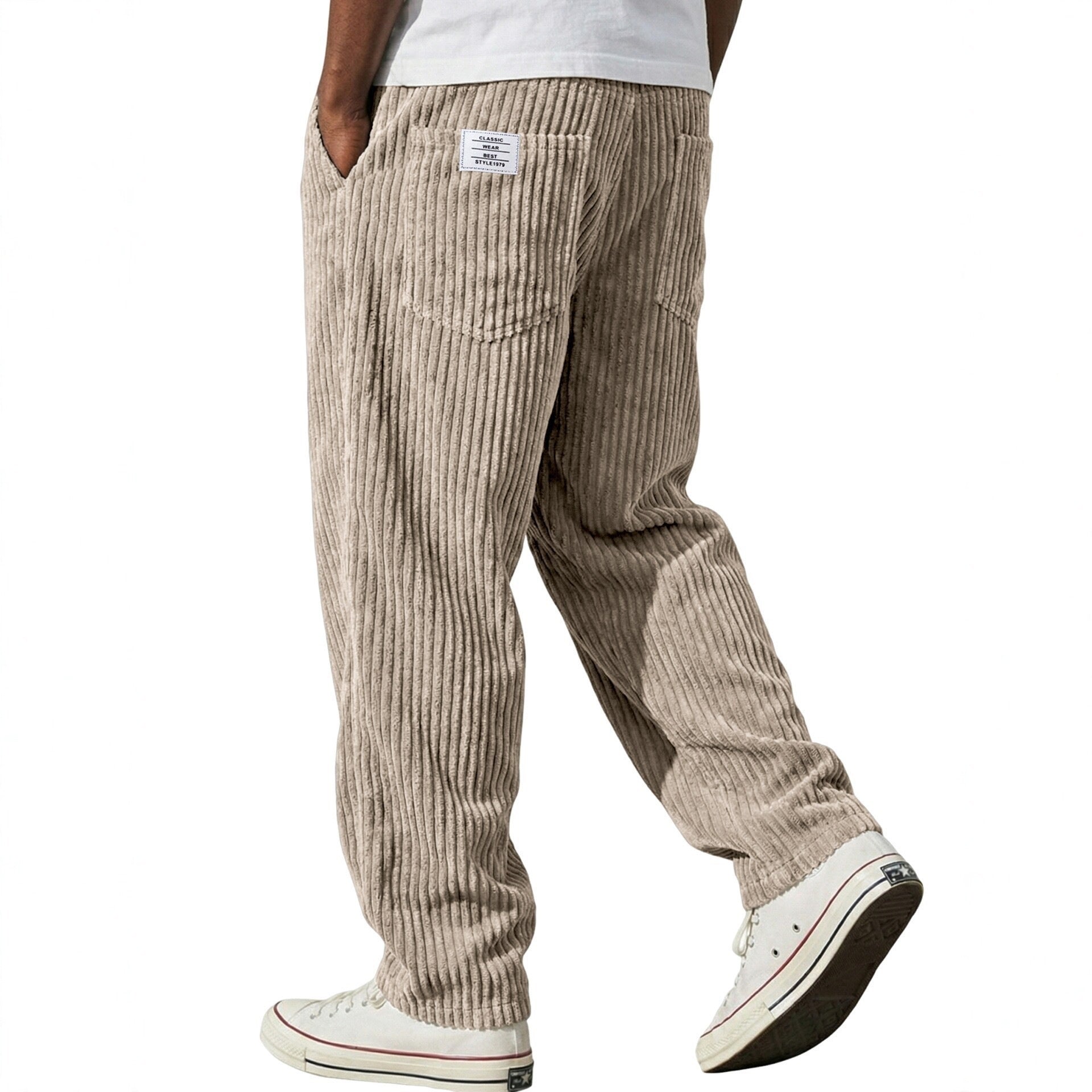 Close view of the deep vertical corduroy wales woven into the soft trouser fabric