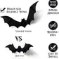 Black 3D bat wall sticker with raised wings standing off a pale wall surface