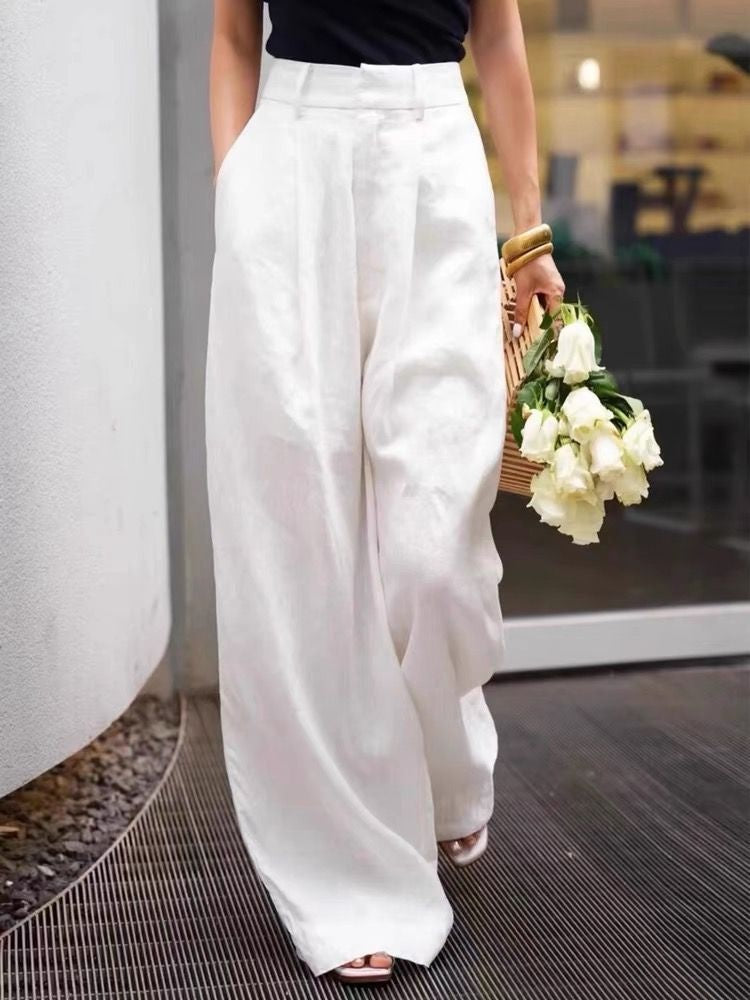 Cotton linen wide leg trousers showing the relaxed wide leg and matte fabric hand