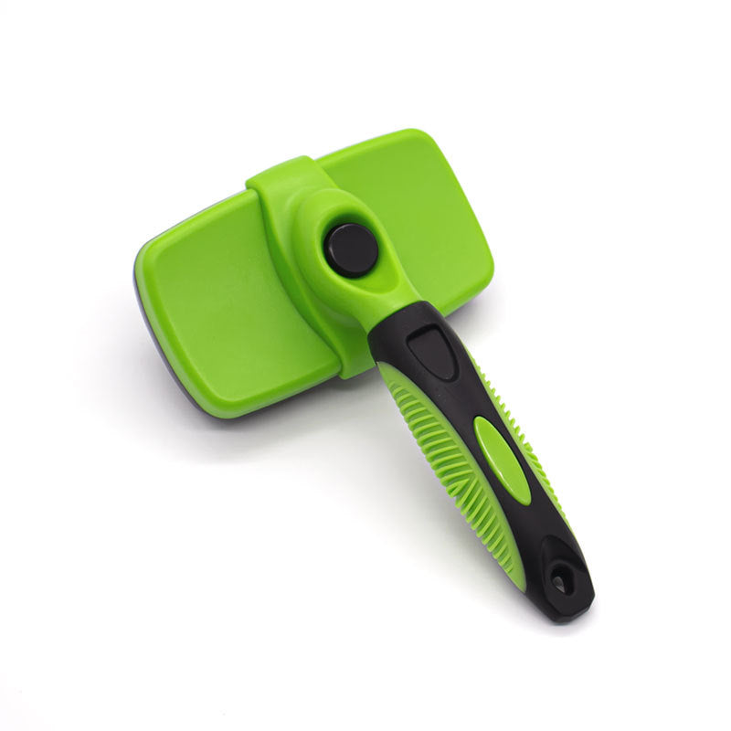Green self cleaning pet slicker brush with the retract button and rounded grooming head