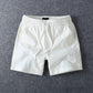 White men's cotton drawstring shorts showing the elastic drawstring waistband