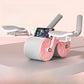 Pink and white ab roller with elbow pads and a phone clip on the crossbar