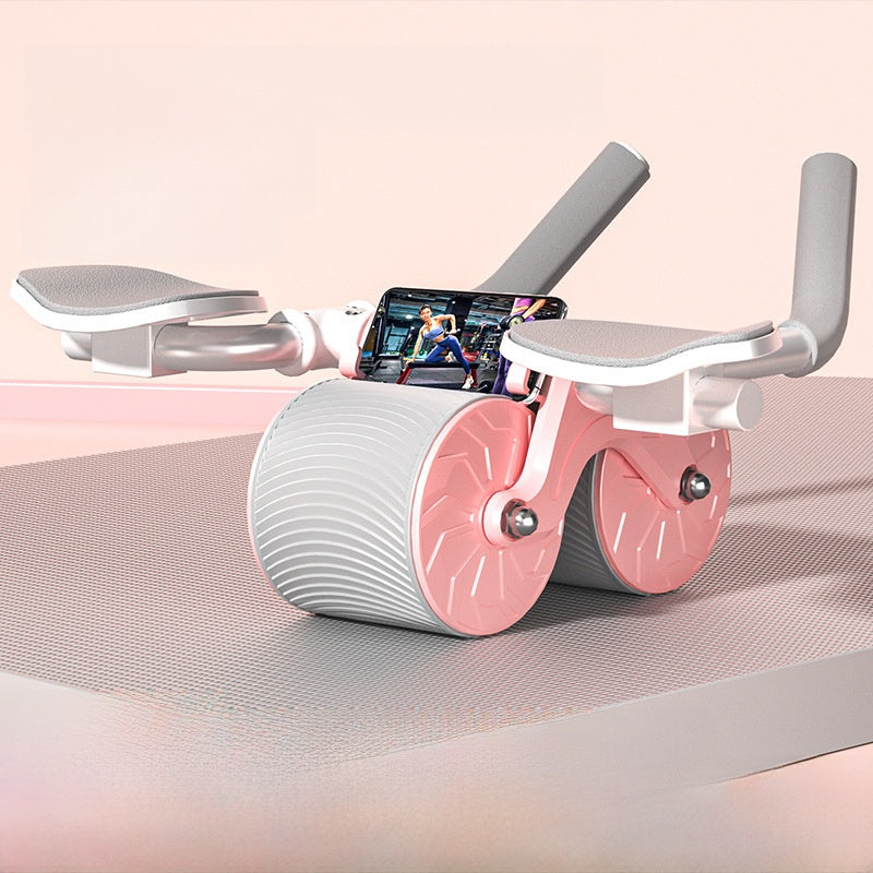 Pink and white ab roller with elbow pads and a phone clip on the crossbar