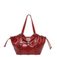 Glossy red hobo shoulder bag with buckle straps, grommets and drawstring sides, option Red