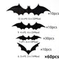 Close view of a folded black 3D bat sticker standing off the wall