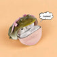 Olive frog case with pink bows open, AirPods Pro resting in the pale pink lower shell