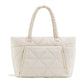 Cream beige padded quilted nylon shoulder bag with rounded handles on white