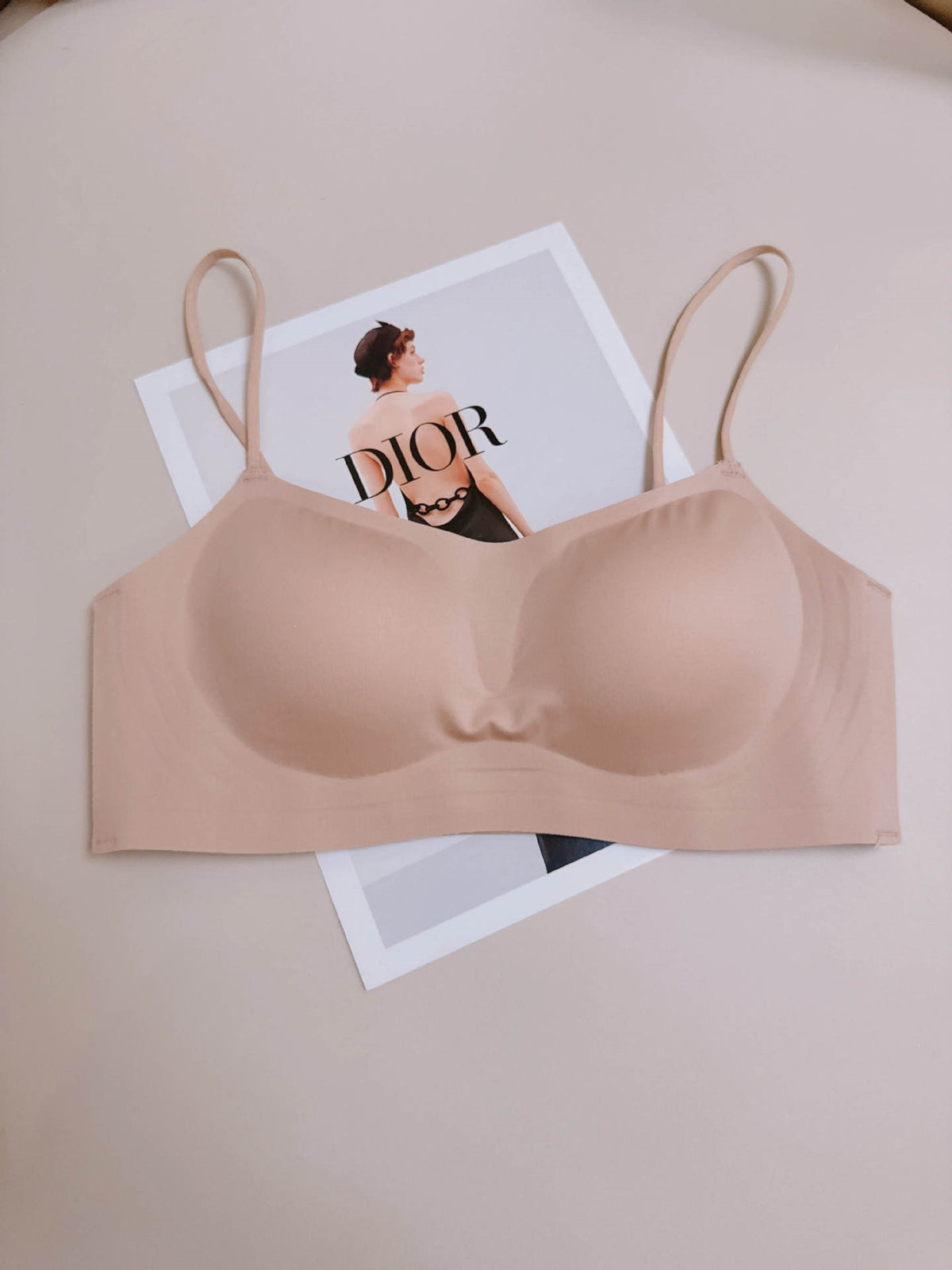 Nude skin tone seamless wireless push up bralette with fixed molded cups and thin straps