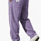 Back view of the wide wale corduroy trousers showing patch pockets and a woven flag label