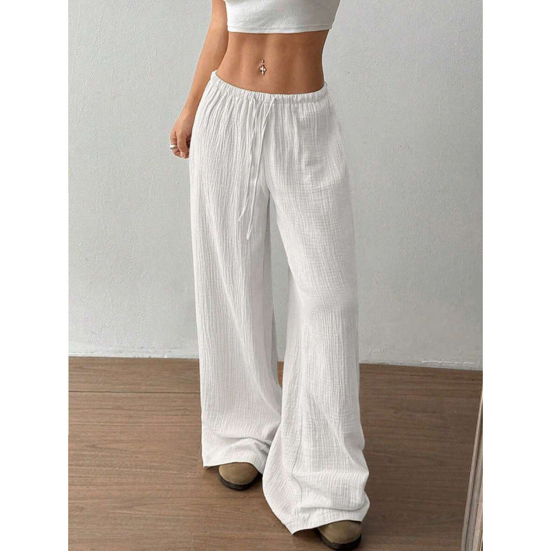 Full length view of wide leg palazzo cotton trousers falling to the floor