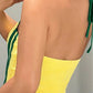 Back view of yellow halter top showing fully open bare back and tie strap