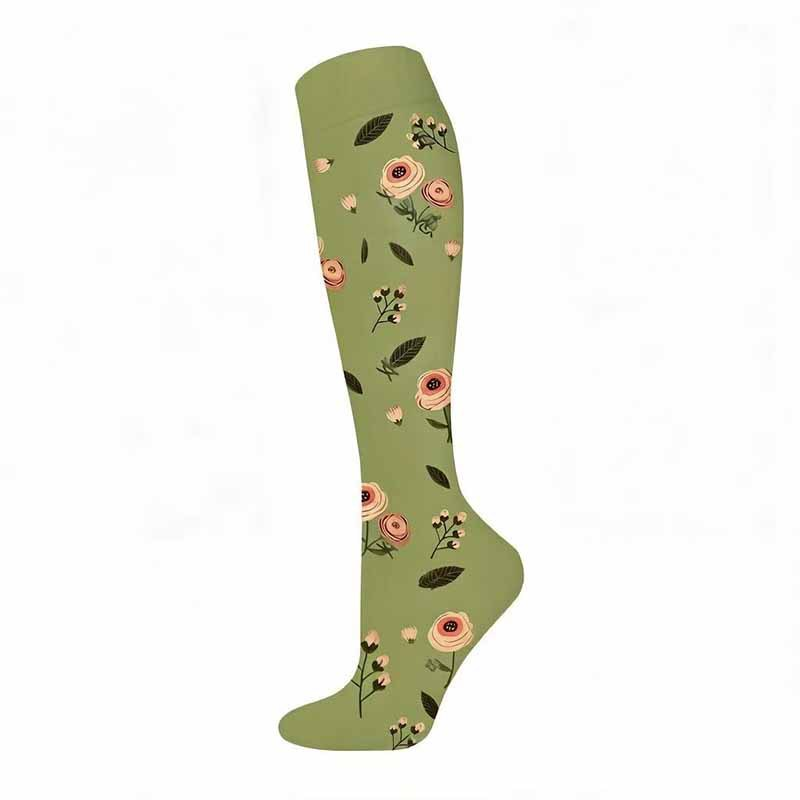 Green knee-high compression sock with peach rose sprigs and dark leaves, size L/XL, on a white background