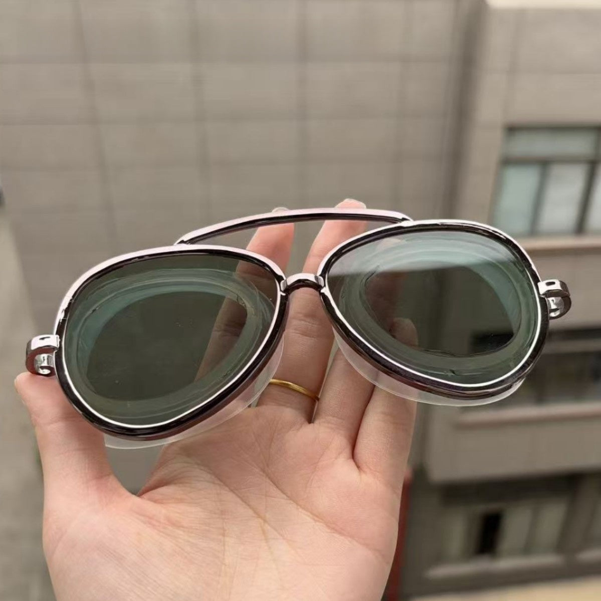 Full view aviator swim goggles with polycarbonate mirror lenses and a bungee strap