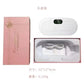Pink gift box opened to show the white heating belt and a coiled white USB charging cable