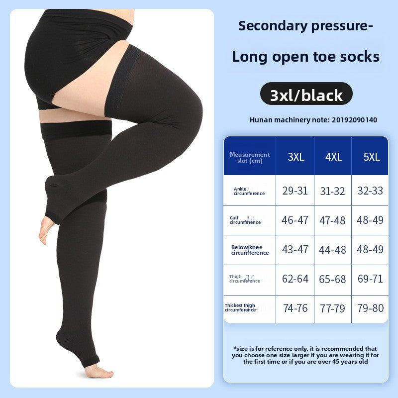 Closed toe black compression sock covering the full foot on a standing leg