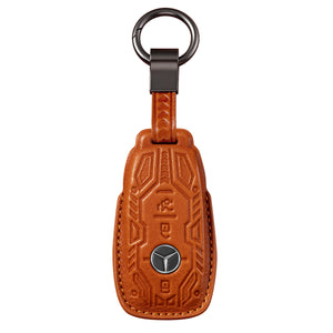 Front of the red cowhide key cover showing the raised mecha pattern and the star medallion in its recess