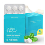 Teal box of peppermint caffeine chewing gum with a blister of nine scored tablets and fresh mint leaves