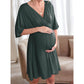 Side view of the maternity dress draping over a full bump in solid stretch jersey