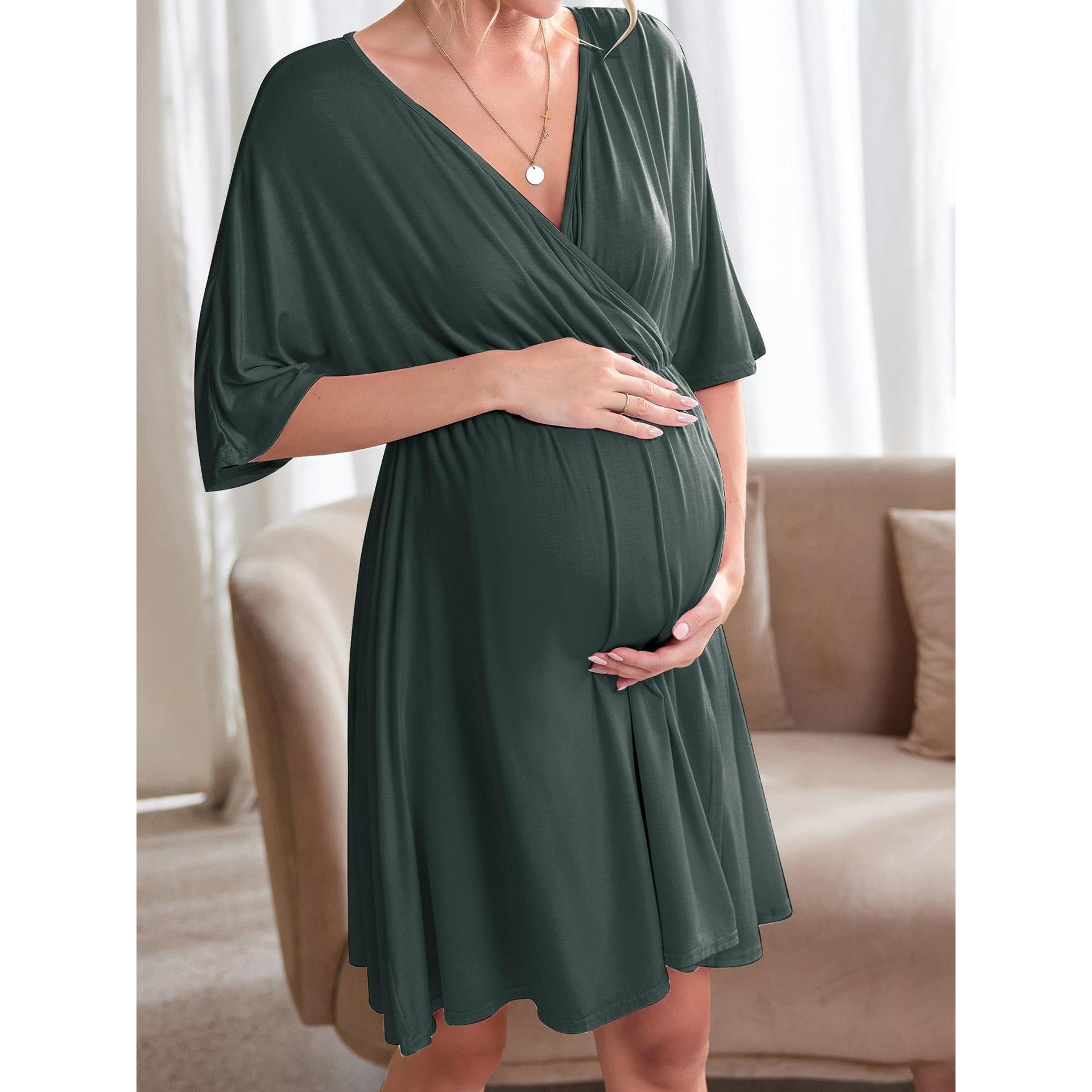 Side view of the maternity dress draping over a full bump in solid stretch jersey