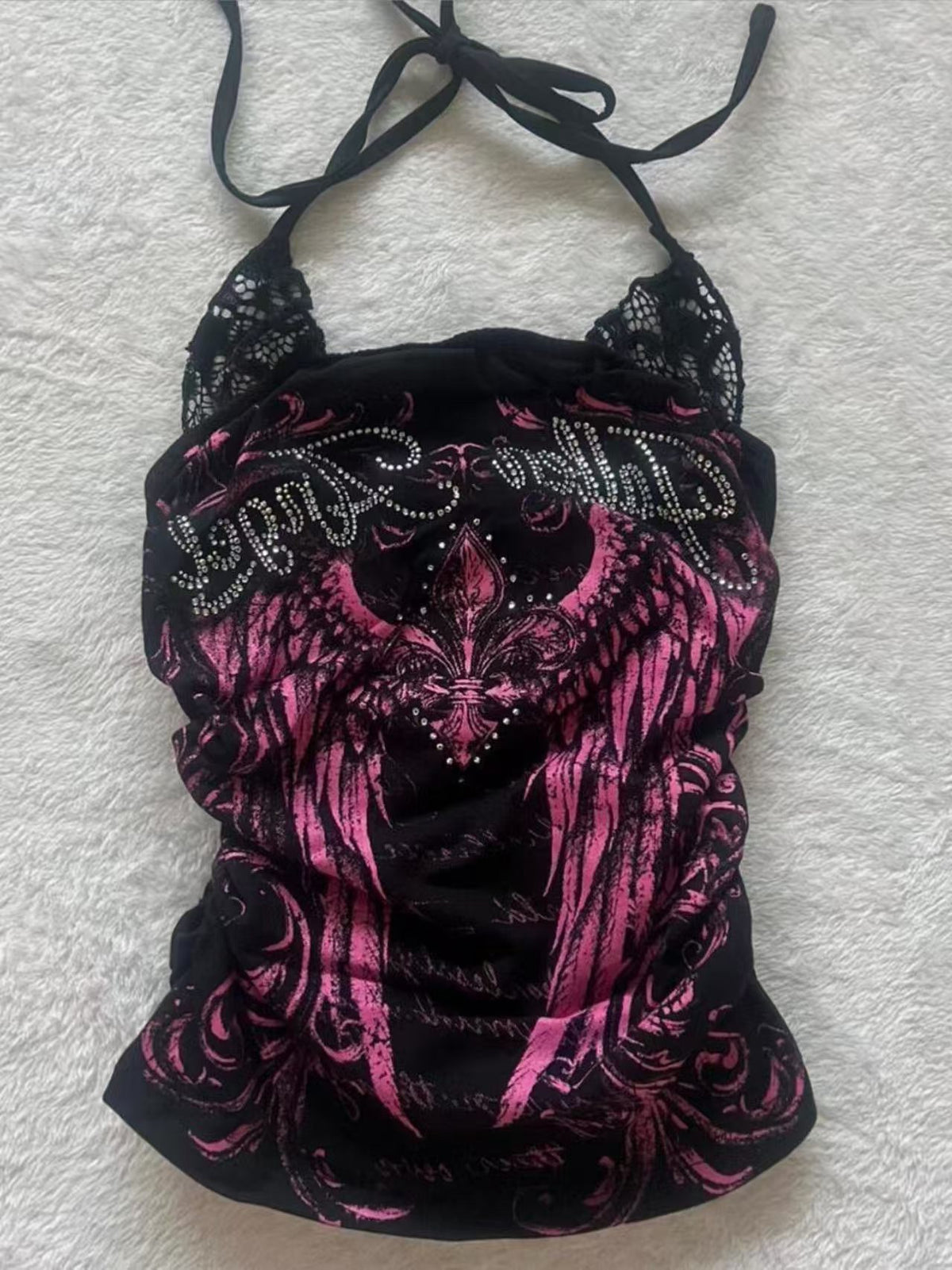 Black and pink halter top with pink wing print and rhinestone lettering, shown on the Black and Pink size S option