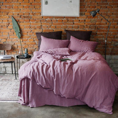 Solid color cotton linen duvet cover with coconut buttons and matching pillowcases on a bed