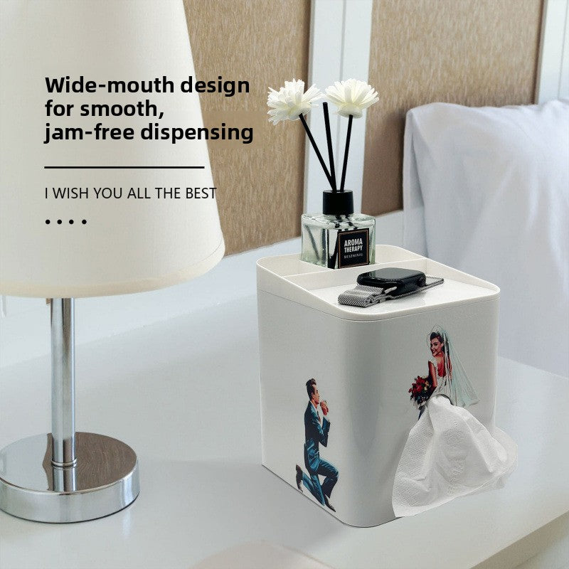 White square tissue box with a bride gown formed by tissue and a kneeling groom printed on the side