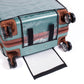 See through PVC luggage protector wrapping a hardshell rolling travel case