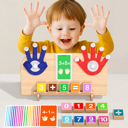 Smiling young child with raised hands behind a wooden finger math board with blue and red felt hands and a 3 plus 5 card