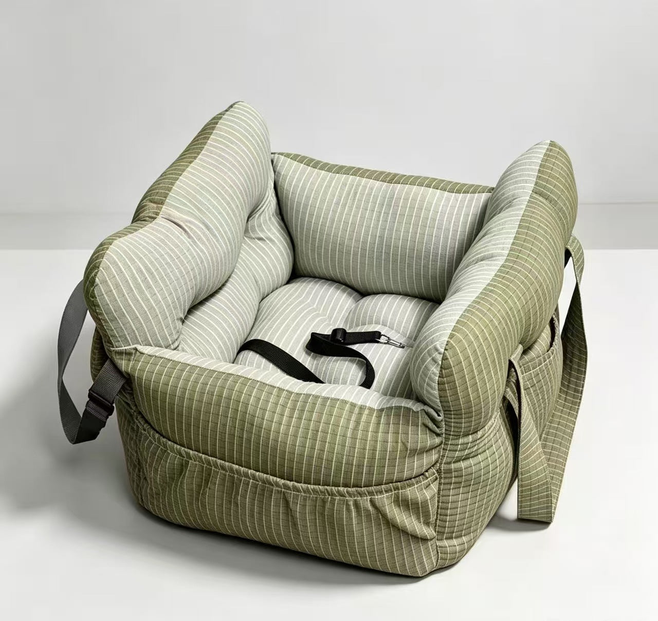 Padded car seat pet bed with raised bolster walls, carry handles and an inner clip detail of the padded bolster wall