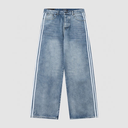 Wide-leg washed blue denim jeans with white side stripes, front view five-pocket cut