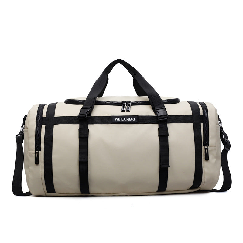 Close view of the zip pull and webbing strap hardware on the travel duffel bag