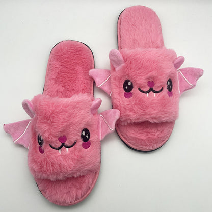 Single bat plush slipper photographed on a clean studio background