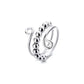 Adjustable spinner bead ring in silver tone photographed on a plain white studio background