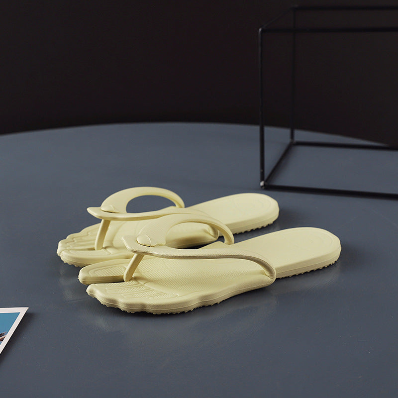 White flip flops close up on the arch buckle that locks the fold shut