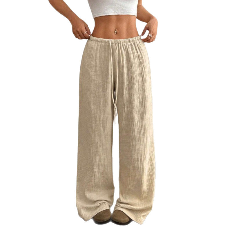 Side view of the loose wide leg cotton trousers showing the crinkle weave
