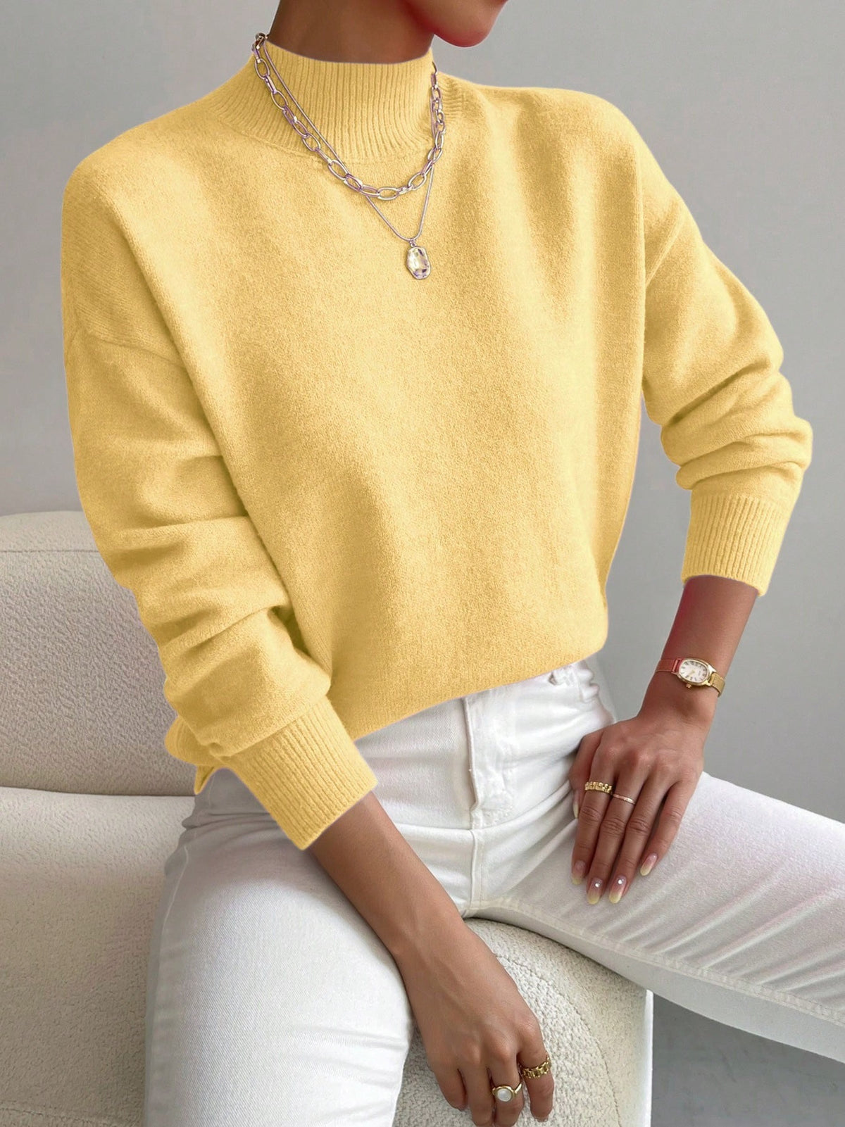 Yellow half-high neck pullover sweater with long sleeves worn with white trousers, size L variant image