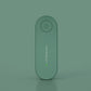Green flat oval ion generator standing upright against a matching green background