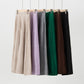 Six ribbed knit midi skirts hanging side by side in beige, lilac, gray, green, brown and black