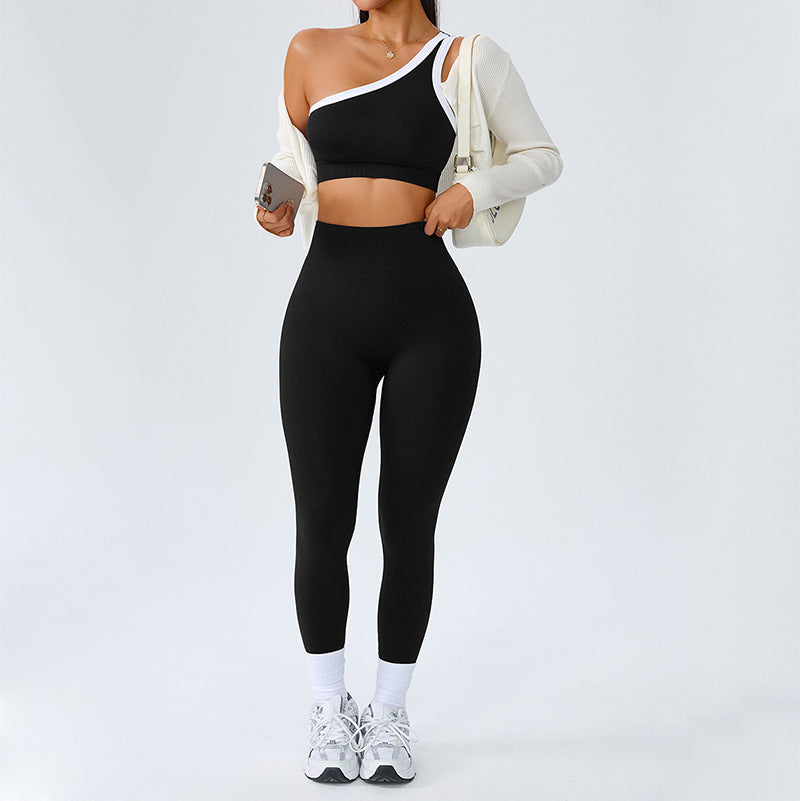 Black one shoulder yoga set with white trim, crop sports bra and high waist leggings
