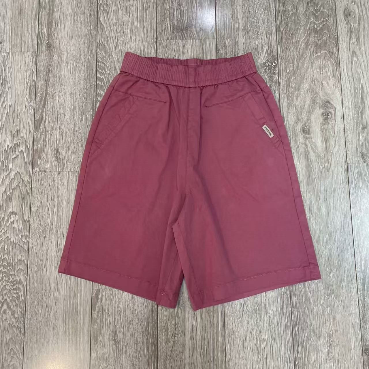 Wide leg shorts detail showing the soft washed woven fabric surface