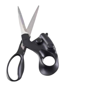 Laser scissors on white, black plastic housing with two round buttons and a large round finger ring below it