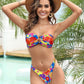 Bandeau O-ring bikini styled under a light summer cover-up at the beach