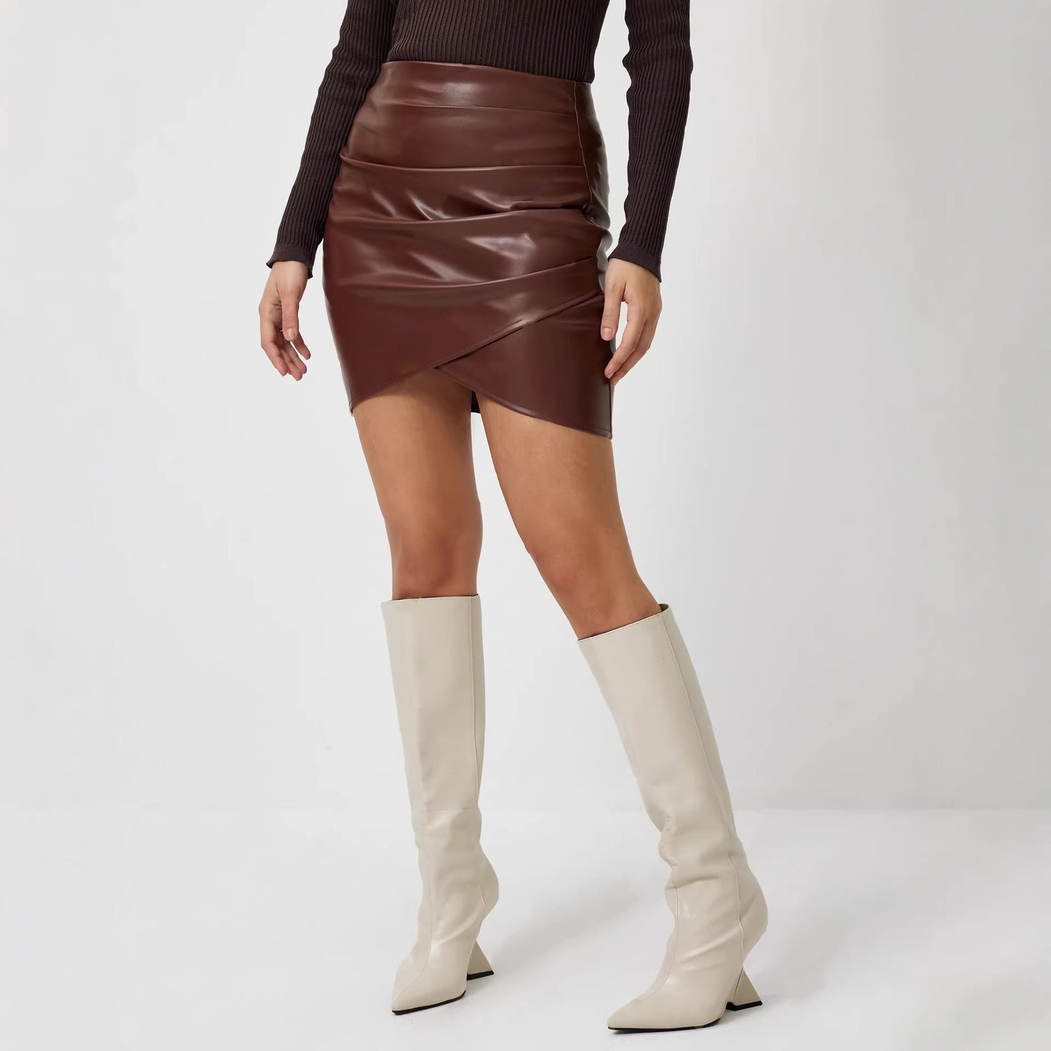 Close-up of the clean hem and fluid fabric of the women's top
