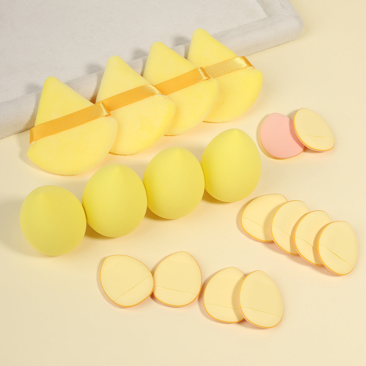 Full boxed set with foam sponges, velvet puffs, a spa headband and a facial cleansing brush