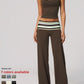 Model in a brown cropped camisole and wide leg pants with a striped fold over waistband, with a seven color swatch
