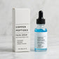 Copper Peptides facial serum bottle and white carton on a light marble surface