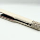 Close view of hair straightener rose gold vented plates and geometric etched cap