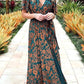 Green floral burnout velvet maxi dress worn on a model against a plain studio wall